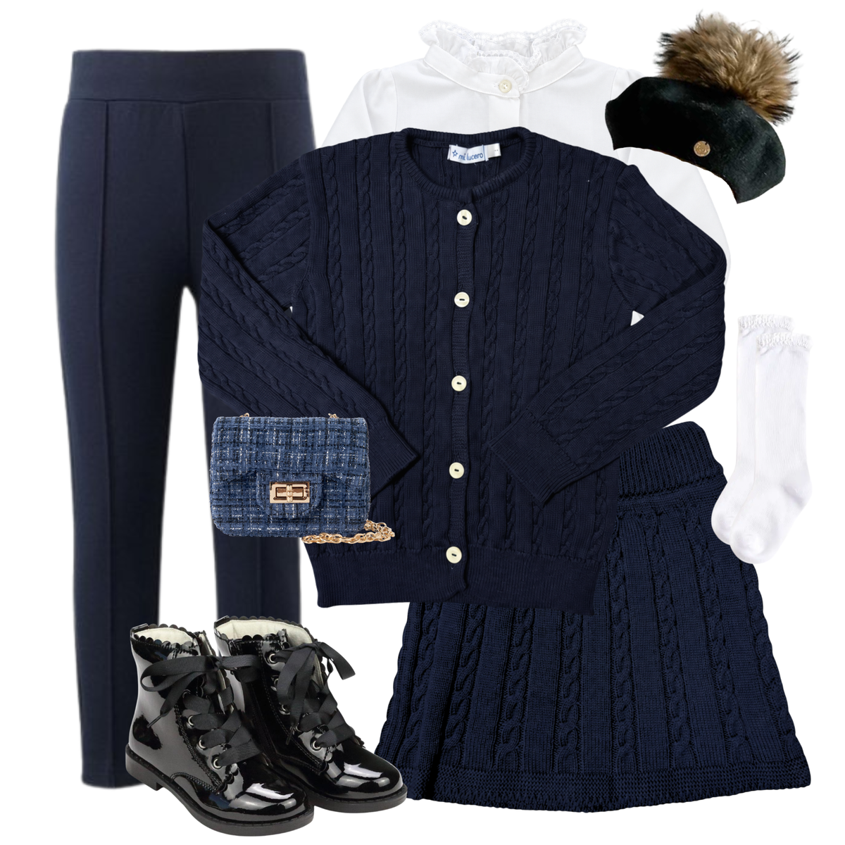 The Château Bleu girls' navy cable knit cardigan and skirt ensemble with ruffled white blouse, black fur pom beret, navy tweed bag, lace knee socks, and black patent boots