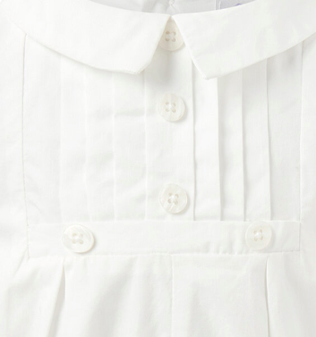 Close-up of a white shirt with buttons on a white background